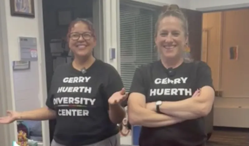 this is a photo of NHCC staff, Justice and Christie from the DEI department, smiling together in the Gerry Huerth Diversity Center. 