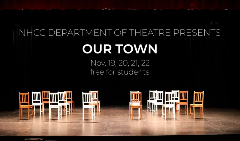 chairs on a stage with dramatic lighting
