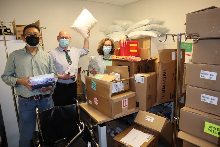 Photo of NHCC faculty with medical donations 