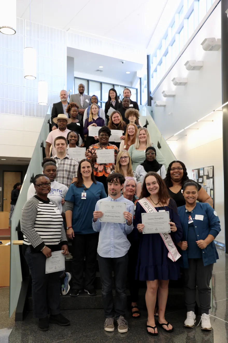 photo of NHCC student scholars standing on the CBT staircase