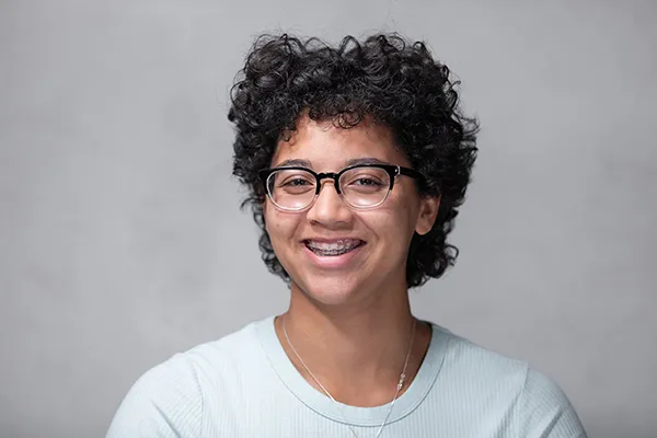 woman smiling wearing glasses