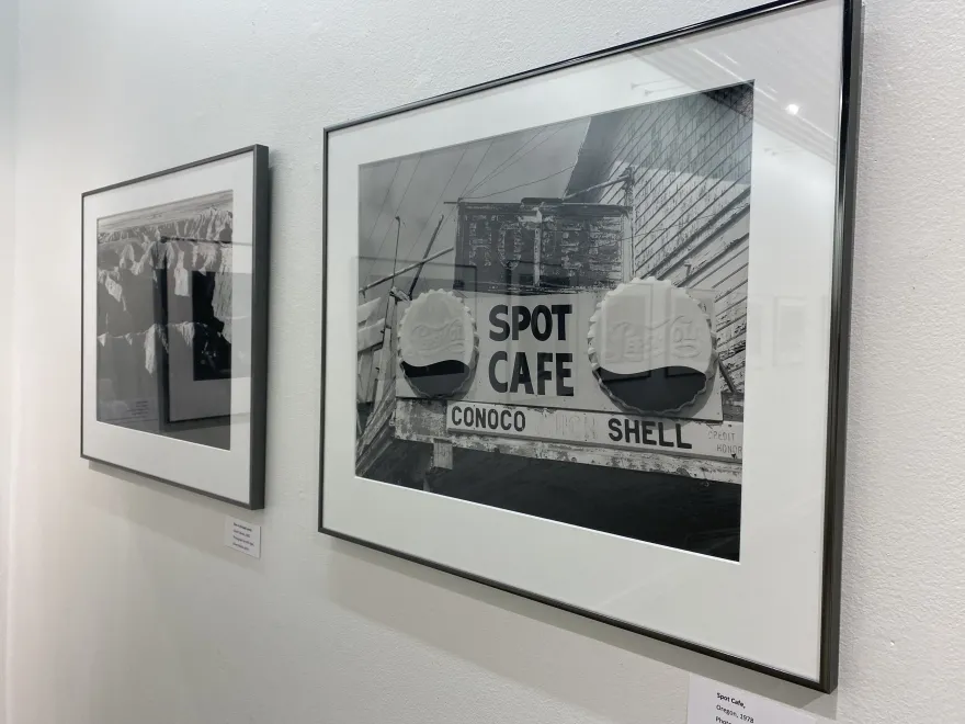 a black and white photo of a cafe sign 