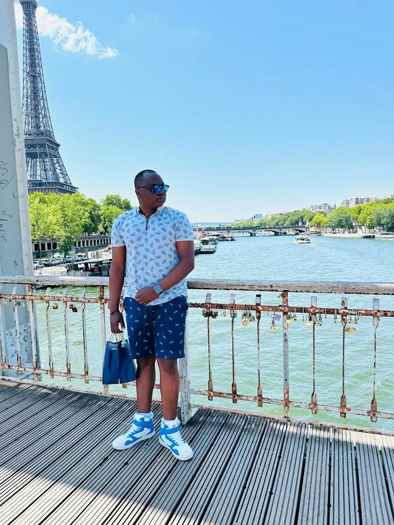 a photo of NHCC student, Donald Agik by the Eifel Tower 