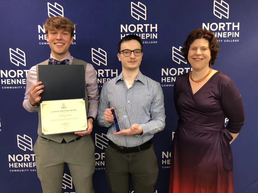 members of the Biology Club and Dr. Tam Mans in 2024 with their award