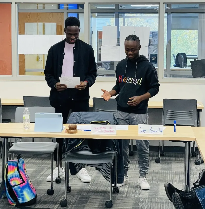 Sylvester swearing in new Student Senate member, Gabriel 