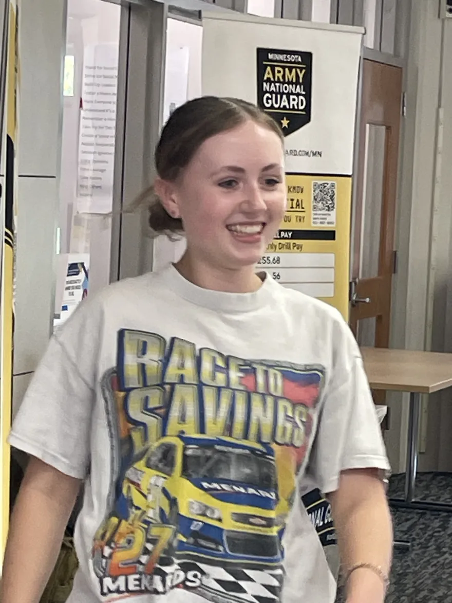 a photo of an NHCC student who won the planking fitness challenge, smiling