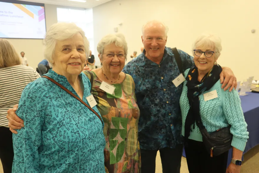 a photo of former NHCC administrators and faculty smiling at the Retiree Luncheon 