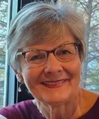 woman smiling with glasses