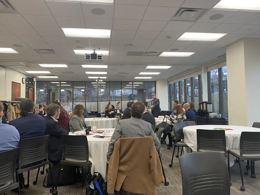a photo of Minnesota State Chancellor Olson speaking to a room of people at the legislative breakfast at Saint Paul College.
