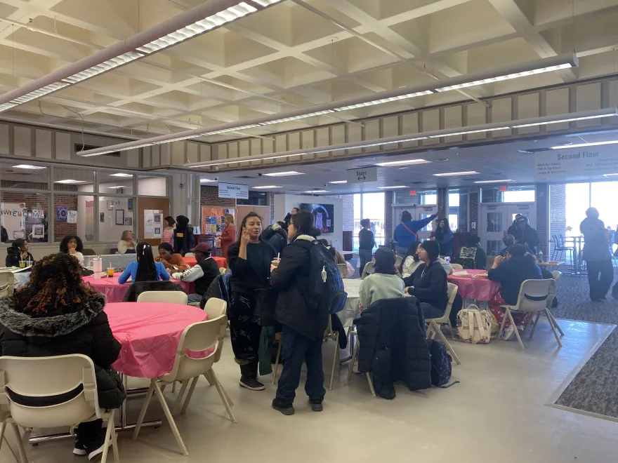a photo of students gathering, sitting at tables and conversing at our Student Appreciation Day event in the Campus Center. 