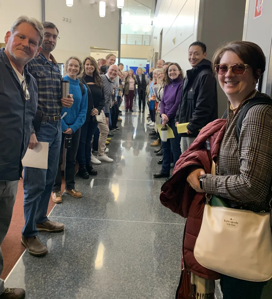 a group photo of NHCC faculty smiling at Duty Day in the CBT building on-campus in January of 2025. 