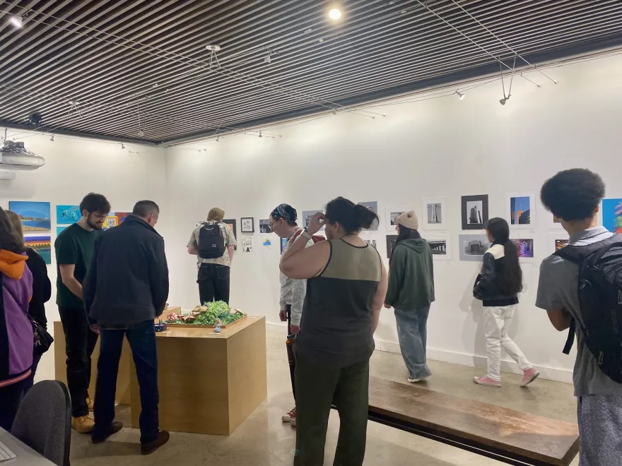 this is another photo of students congregating in the NHCC Art Gallery before the Student Art Show Reception.