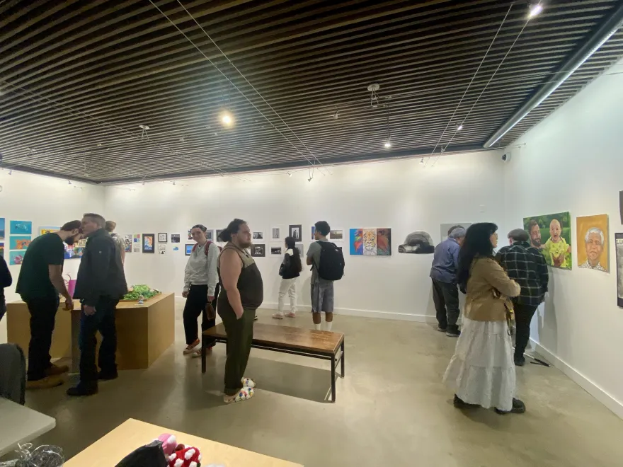 this is another photo of students congregating in the NHCC Art Gallery before the Art Show Reception.
