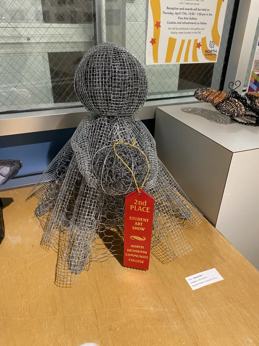 This is a photo of a sculpture that received a second-place award at the NHCC Student Art Show, titled, “Ghost Girl.” 