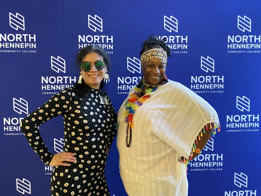 This is a photo of NHCC staff Hanh and Tarsha posing for a photo at their Student Life Awards Banquet. 