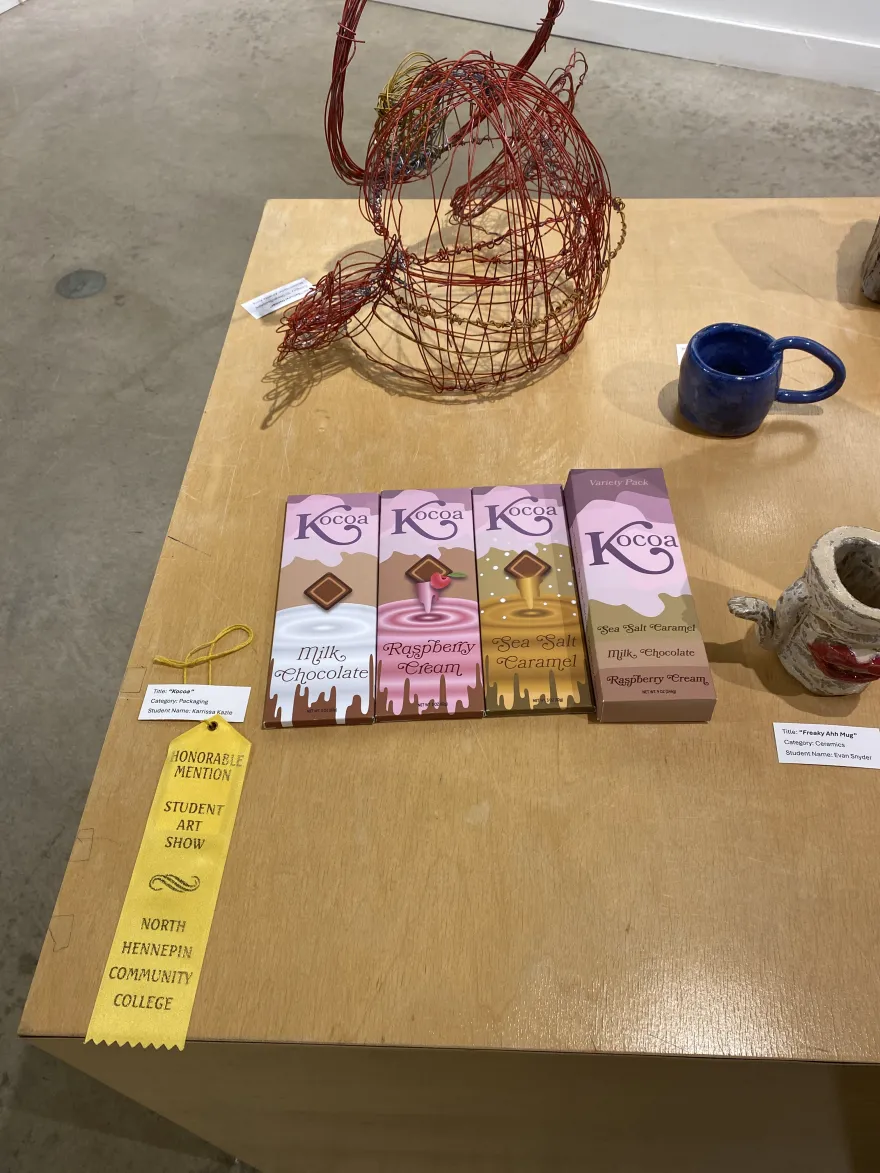 This is a photo of a packaging design that received an Honorable Mention award at the NHCC Student Art Show, titled, “Kocoa.” 