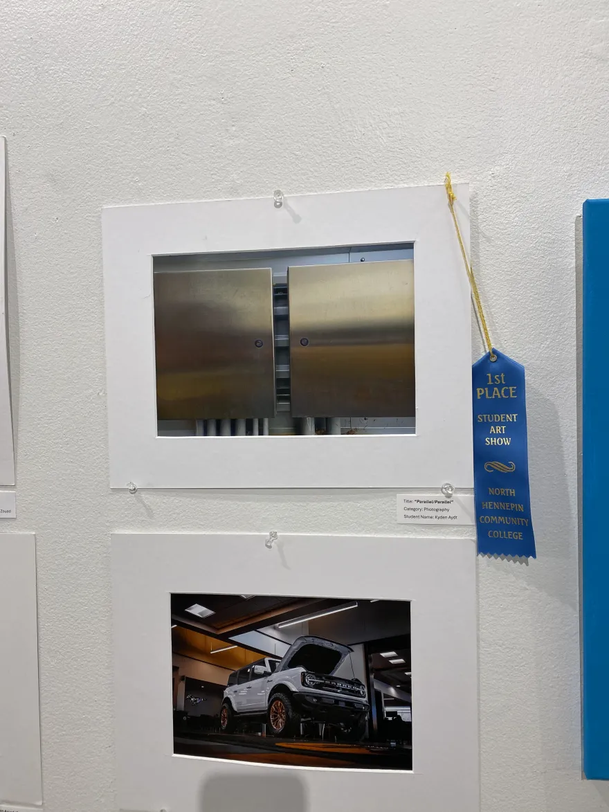 This is a photo of a photographic piece that received a first-place award at the NHCC Student Art Show, titled, “Parallel/Parallel.” 
