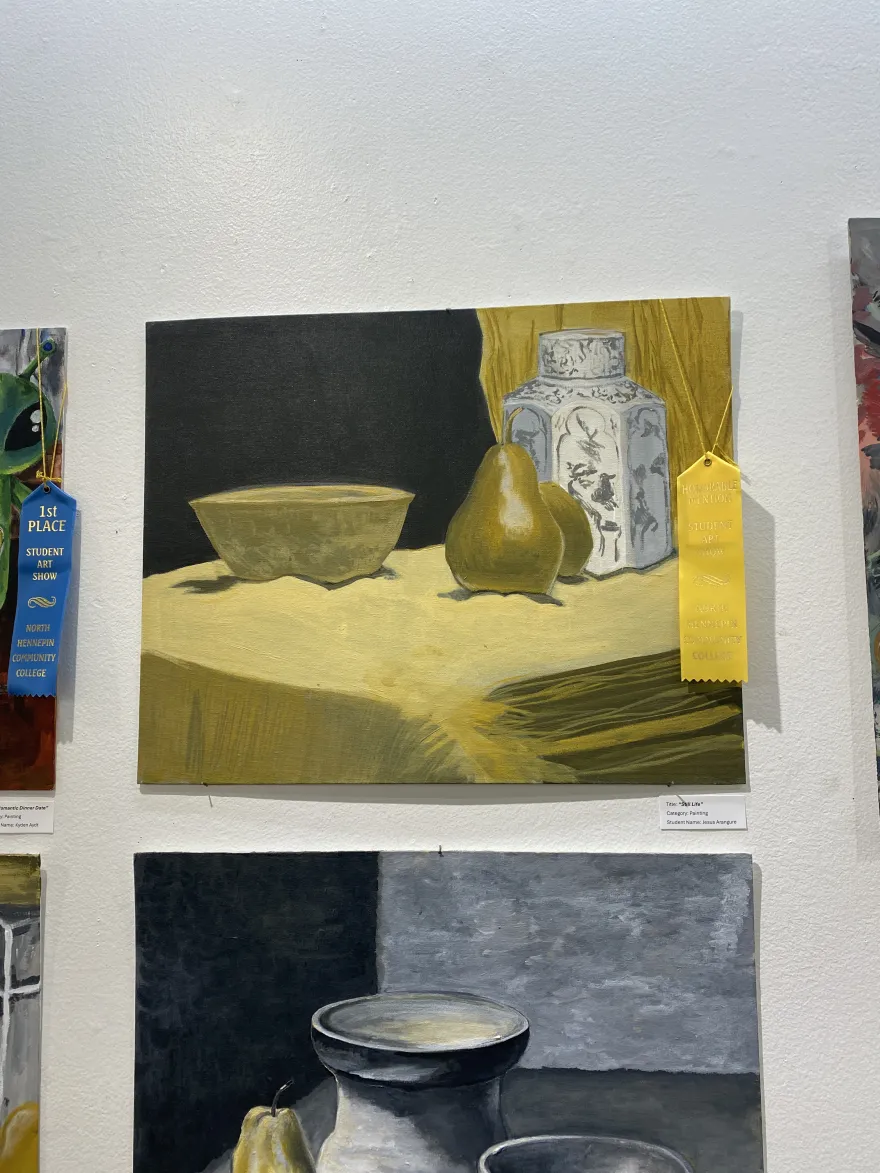 This is a photo of a painting that received an Honorable Mention award at the NHCC Student Art Show, titled, “Still Life.” 