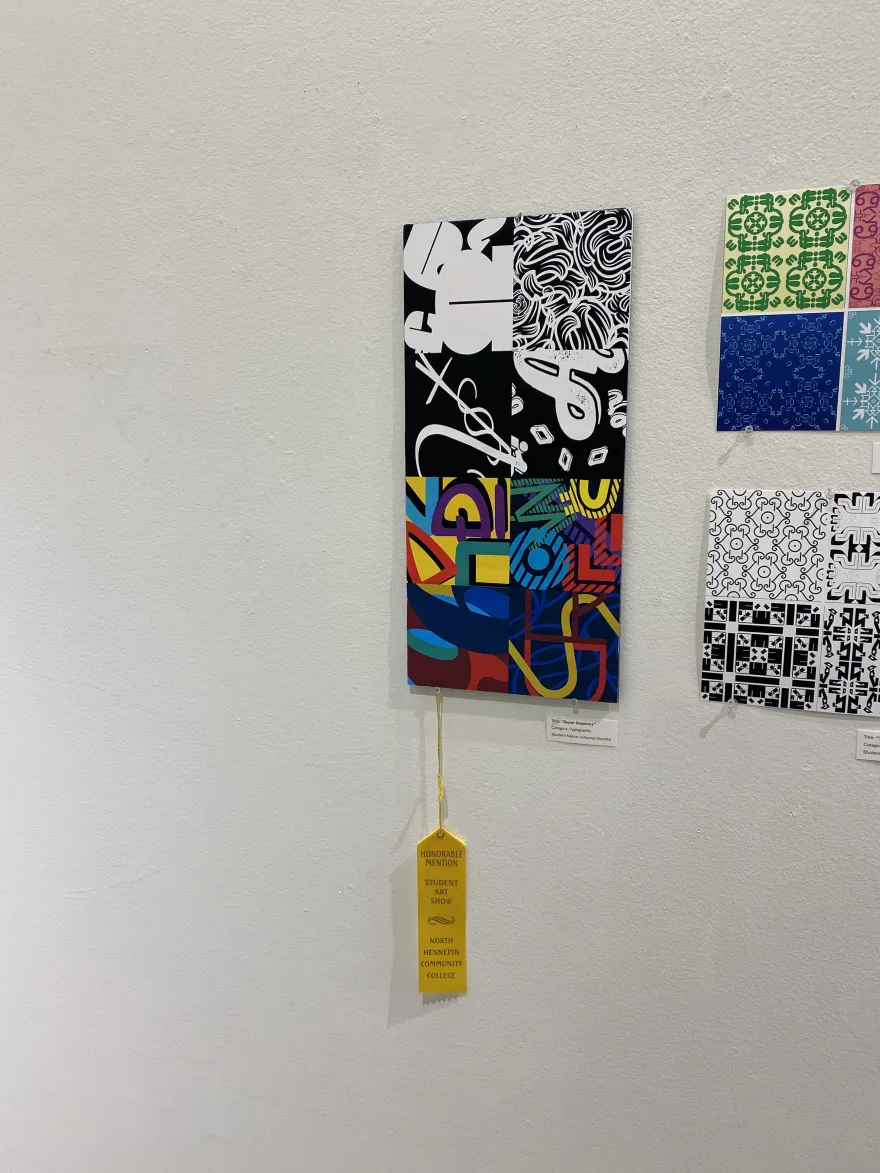 This is a photo of a typography piece that received an Honorable Mention award at the NHCC Student Art Show, titled, “Super Graphics.” 