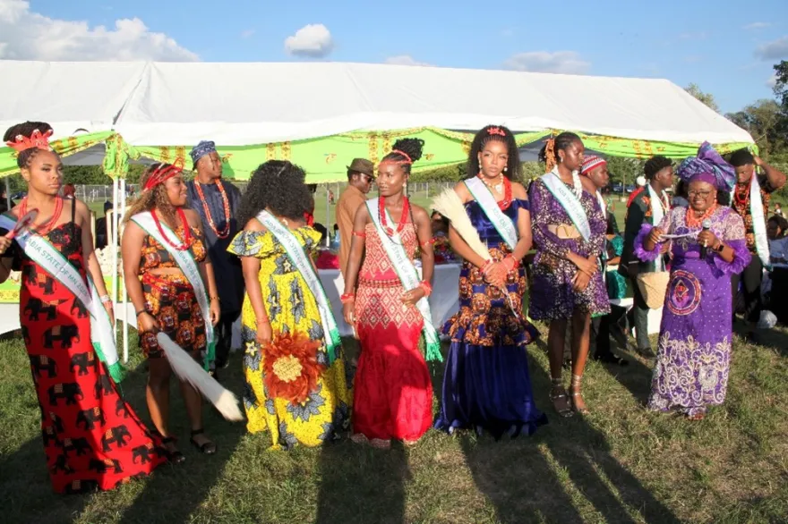 This is a photo of a group of African women at the IgboFest celebration, outside NHCC, dressed in cultural regalia. 