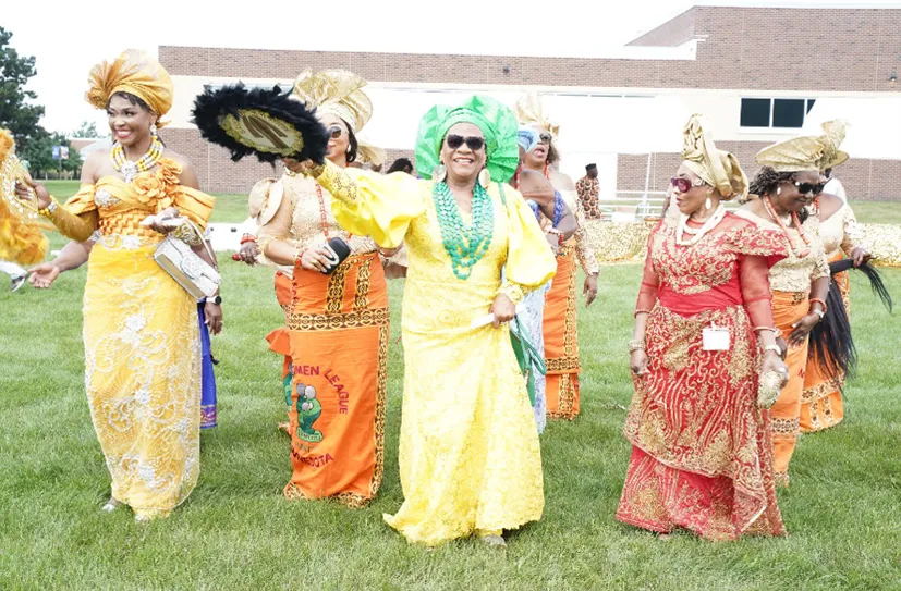 This is a photo of African women smiling and dancing at the IgboFest celebration 