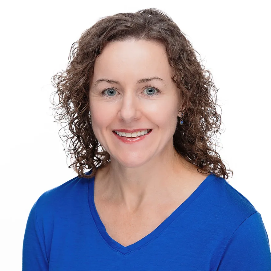 Portrait of Lisa Whalen wearing a blue shirt