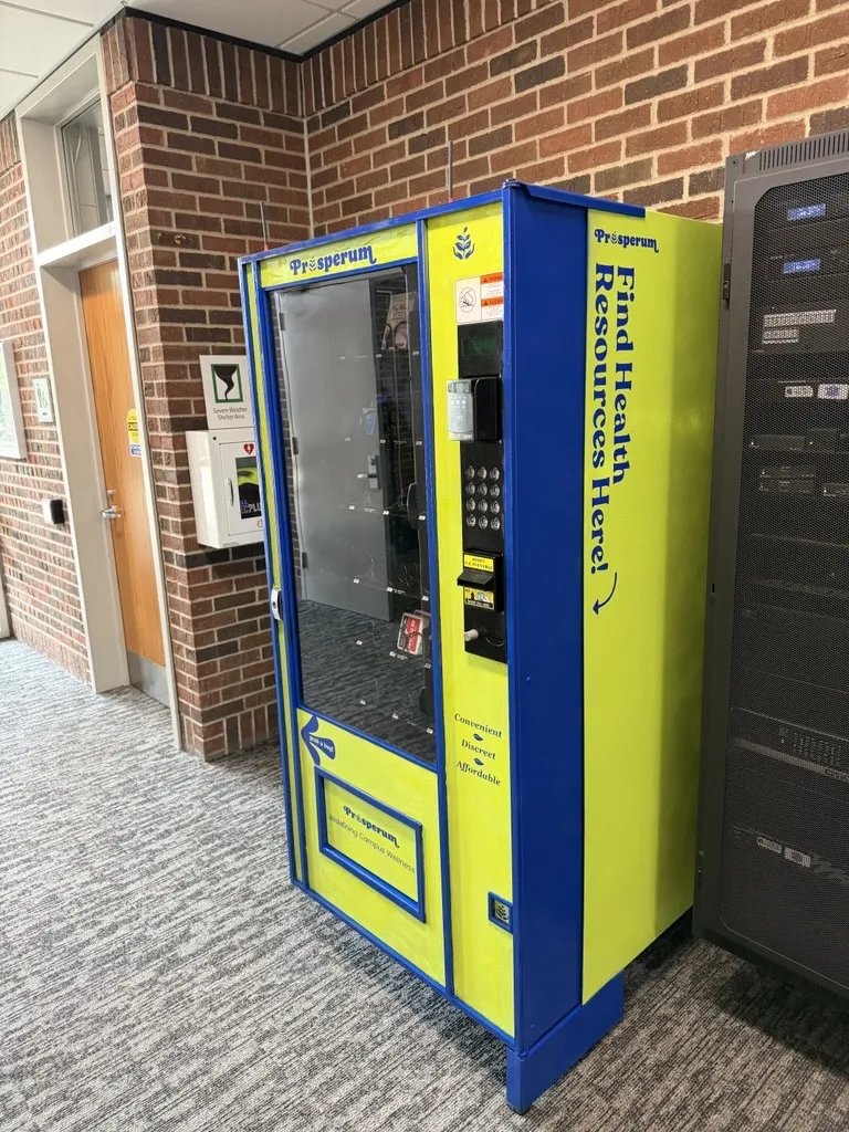 this is a side photo of the new personal care product vending machine in NHCC's Campus Center. 