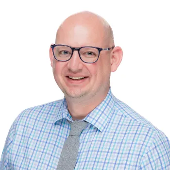 Man in glasses smiling