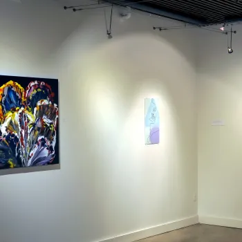 picture of the NHCC art gallery with abstract art on the walls