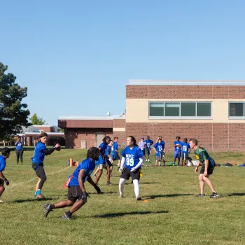 people in field for flag football